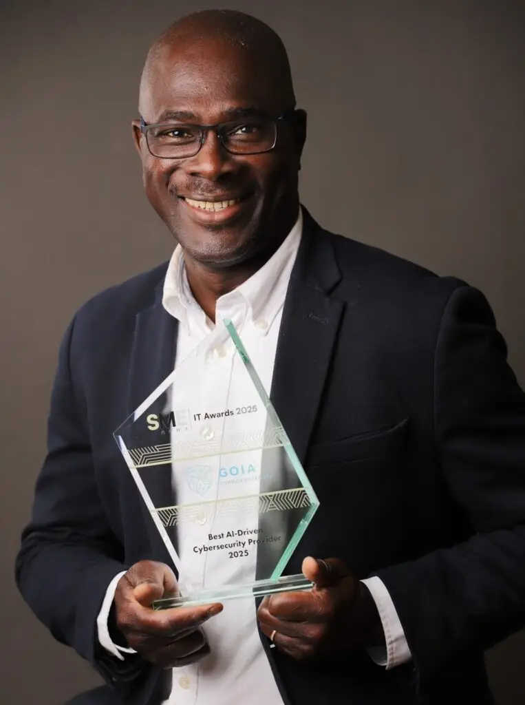 Gerard smiling with the award trophy after GOIA’s 2025 cybersecurity win.